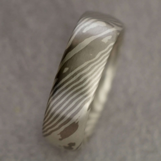 Mokume Gane Fingerring aus 925/- Silber, 500/- Palladium, tordiert mit 8 Sternen