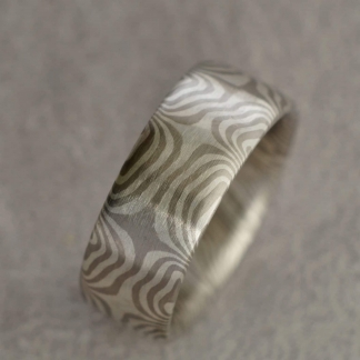 Mokume Gane Fingerring aus 925/- Silber, 500/- Palladium, tordiert mit 8 Sternen